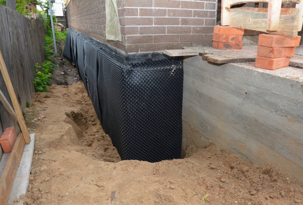 Happy homeowners after waterproofing job in Big Falls